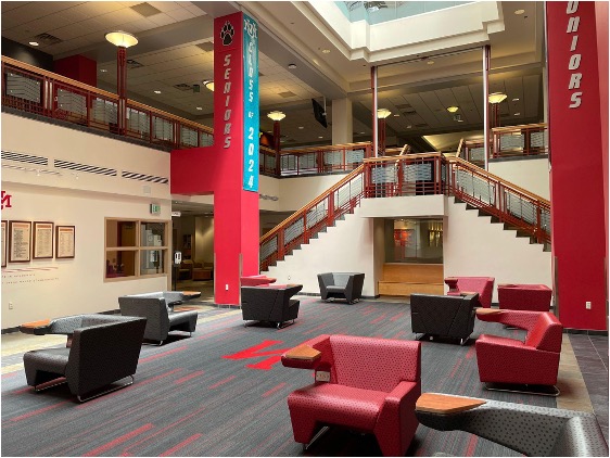 empty lobby with grey and red chairs
